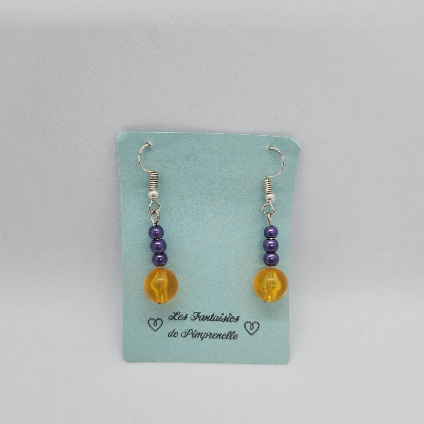 Boucles d’oreilles violettes et oranges