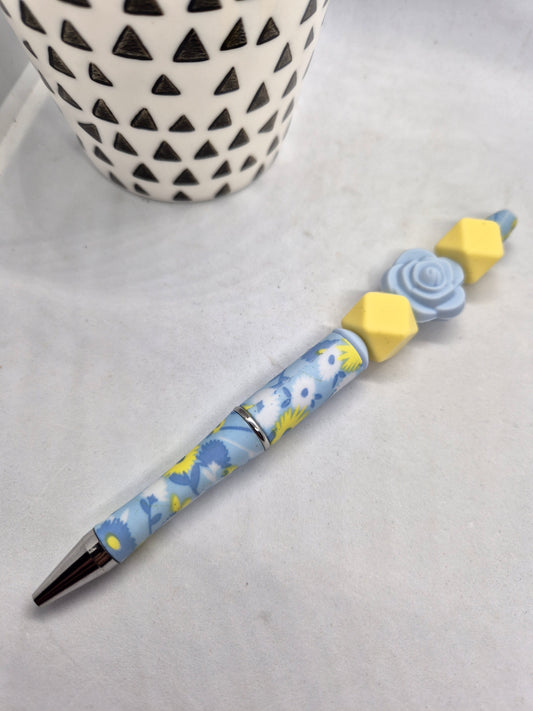 Stylo fleurs jaune et bleu